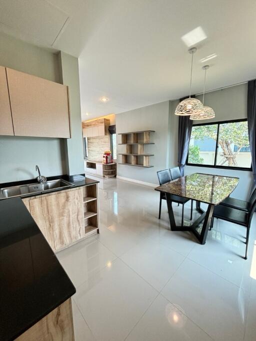 Modern kitchen and dining area with large window