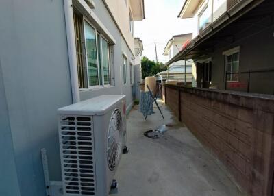 Outdoor walkway with air conditioning unit