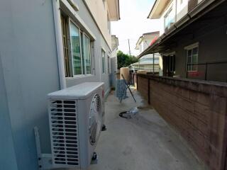 Outdoor walkway with air conditioning unit