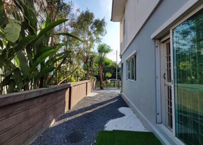 Side yard and exterior view of house