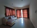 Living room with large windows and a sectional sofa