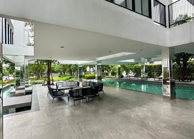 Spacious communal outdoor area with swimming pool and seating