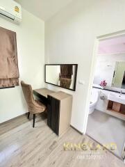 Bedroom with a dressing table and adjacent bathroom