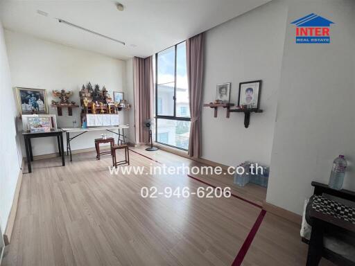 Room with religious artifacts and large window