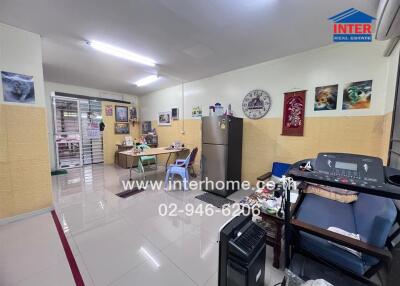 Living room with various furniture and appliances