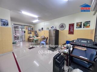 Living room with various furniture and appliances