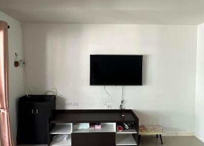 Modern living room with television and storage unit