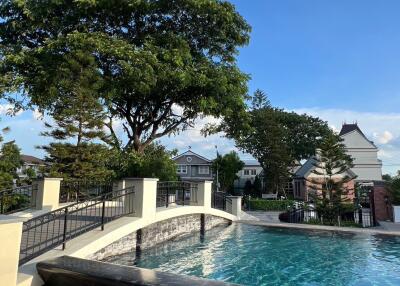 Outdoor area with pool and trees