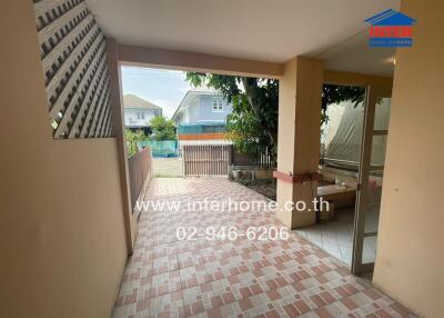 Covered outdoor porch with tiled floor