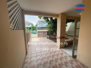 Covered outdoor porch with tiled floor