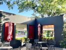 Outdoor patio area with seating and greenery