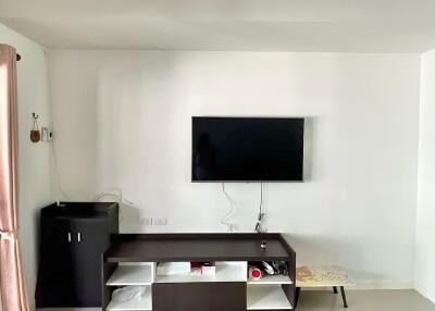 Modern living room with wall-mounted TV