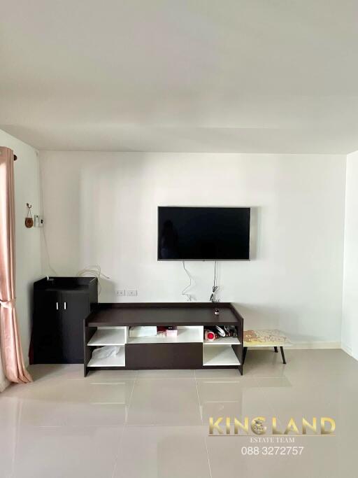 Modern living room with wall-mounted TV