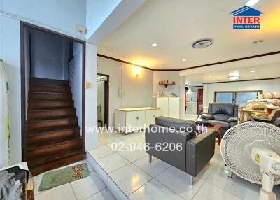 Living room with staircase and furniture