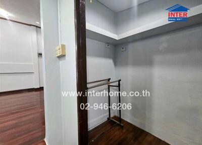 interior space with wooden floor and railings