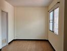 Empty room with tiled floor and window