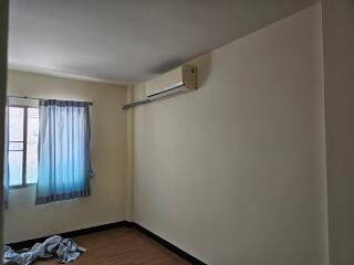 Empty bedroom with air conditioner