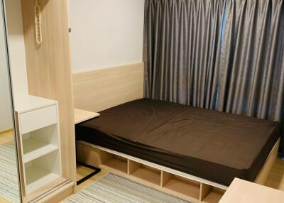 Modern bedroom with built-in wardrobe and large bed