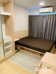 Modern bedroom with built-in wardrobe and large bed