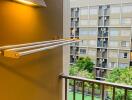 Balcony with view of apartment complex and green courtyard