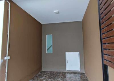 Covered garage space with tiled flooring