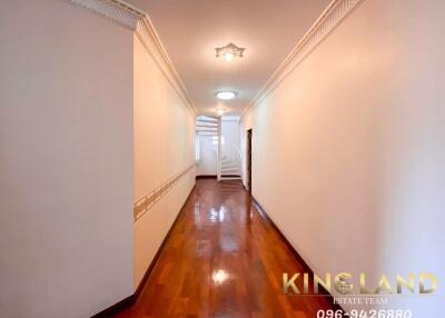 Bright hallway with wooden flooring