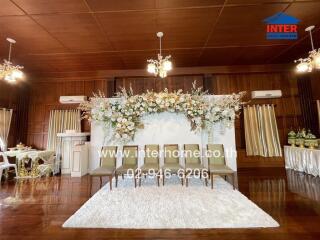 Event room with chairs and floral arrangement