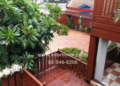 Outdoor patio with lush greenery