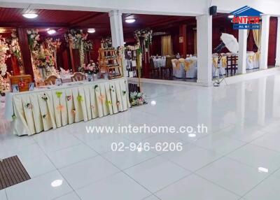 Decorated event hall with seating and decorative elements