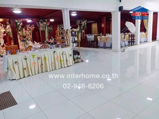 Decorated event hall with seating and decorative elements