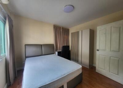 Spacious bedroom with double bed and large wardrobe