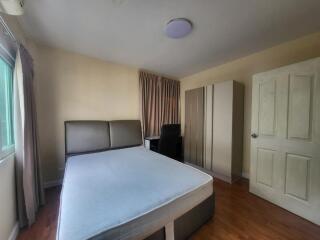 Spacious bedroom with double bed and large wardrobe