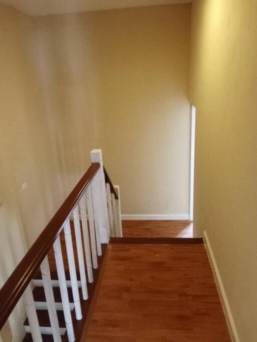 Indoor staircase with wooden steps and railing