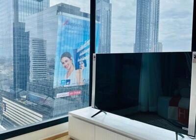 Modern living room with large windows and city view