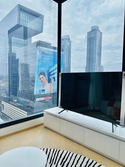 Modern living room with large windows and city view