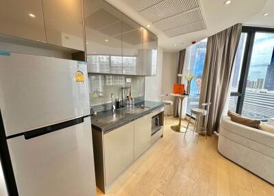 Modern kitchen with stainless steel appliances and dining area