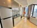 Modern kitchen with stainless steel appliances and dining area