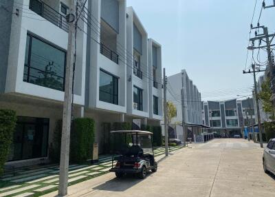 Modern townhouses along a residential street