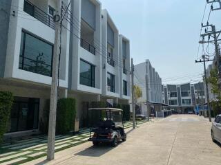 Modern townhouses along a residential street