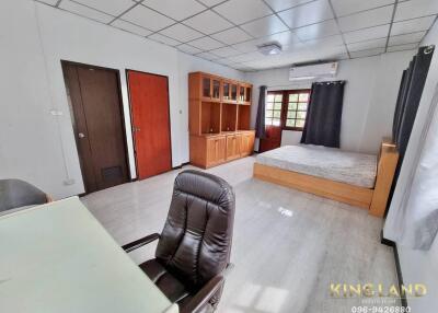 Spacious bedroom with desk and built-in shelving