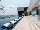 Rooftop pool with lounge chairs and panoramic city views