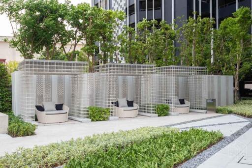 Modern outdoor seating area with greenery