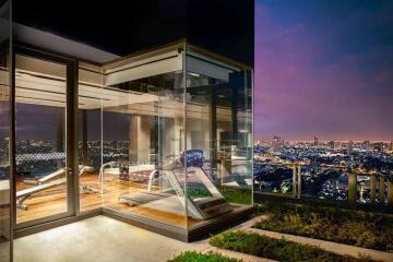 Modern exercise room with large windows and city view