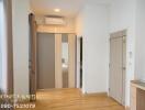 Spacious bedroom with modern sliding door wardrobe and air conditioning unit