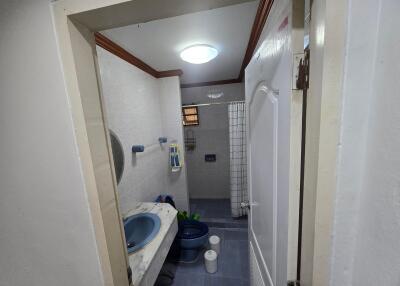 Modern bathroom with blue fixtures and tiled flooring