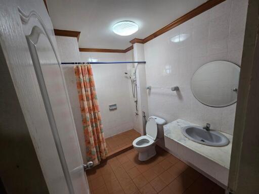 Bathroom with shower, toilet, and sink