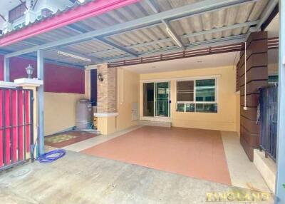 Exterior view of covered garage and front entrance