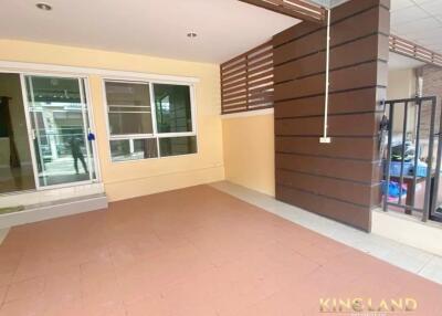 Covered patio area with tiled flooring