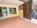 Covered patio area with tiled flooring