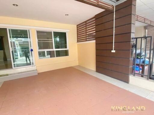 Covered patio area with tiled flooring